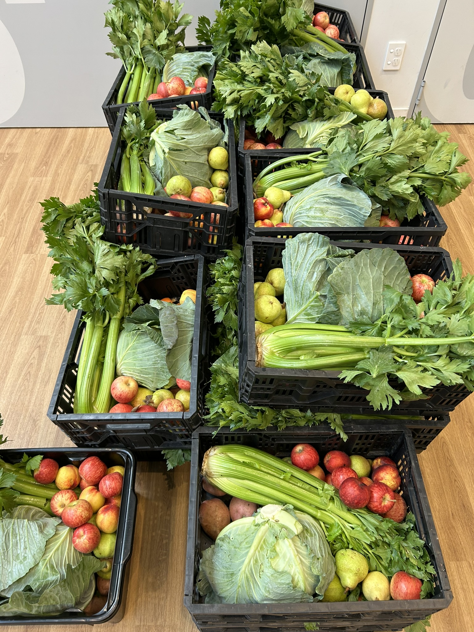 Stacks of crates filled with fresh produce.